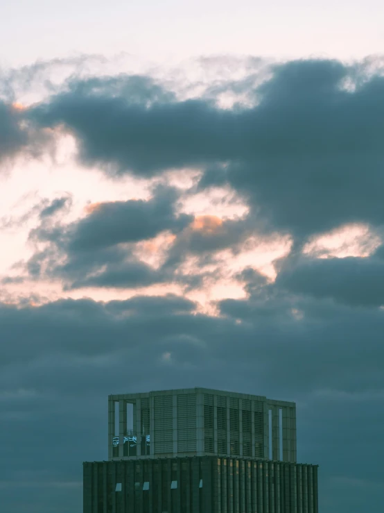 a building with a plane flying over it