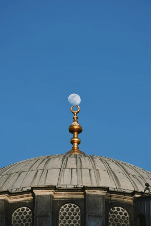 a metal dome with a ring on top