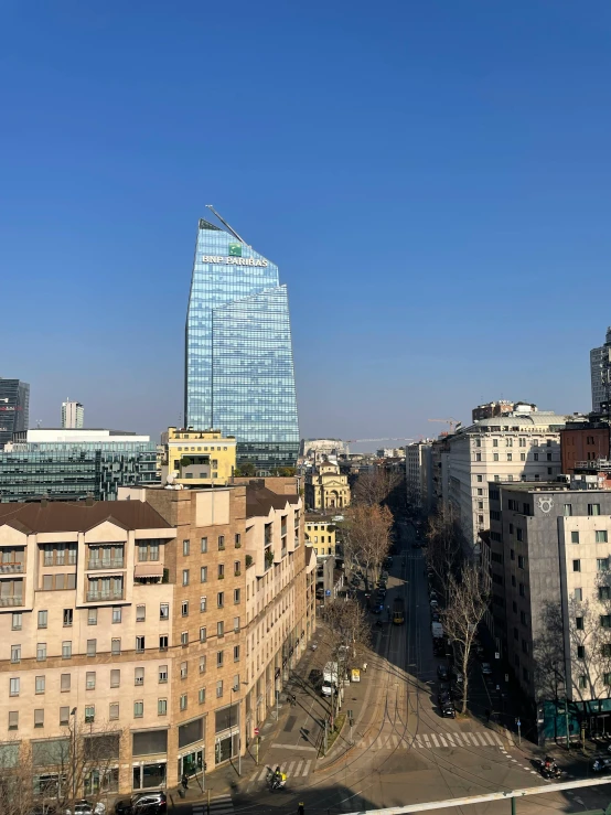 the large blue building is near many other tall buildings