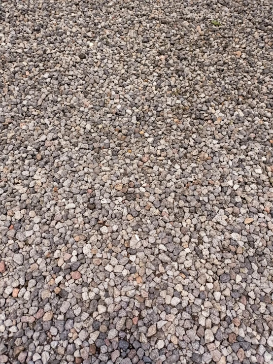 gravel background with a green bus in the distance