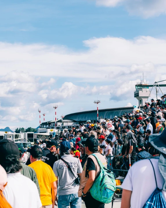 a crowded stadium with many people on the sides