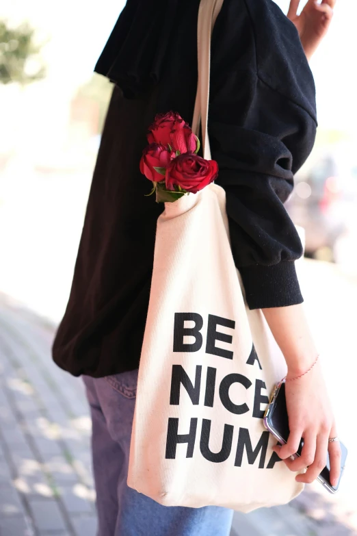 a woman with a flower sticking out of her hand bag