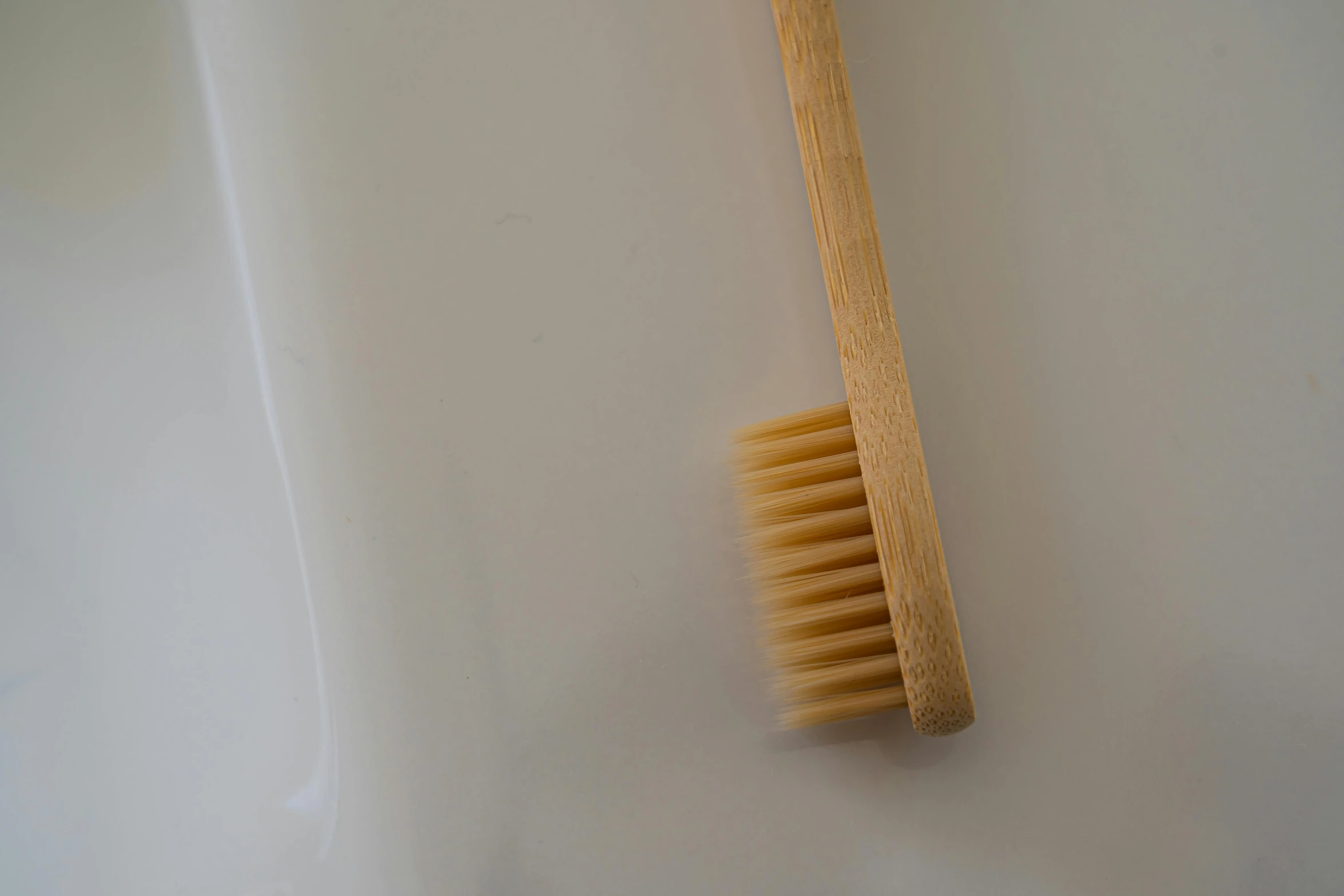 a toothbrush that is standing on a table