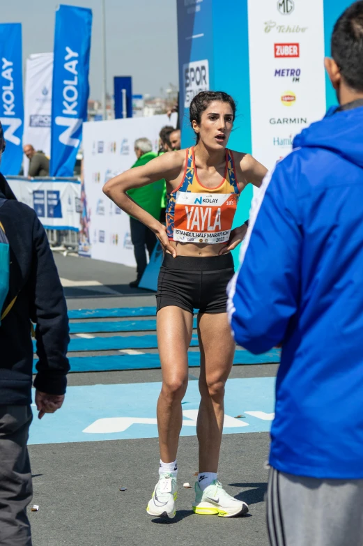 the woman in her race outfit is running