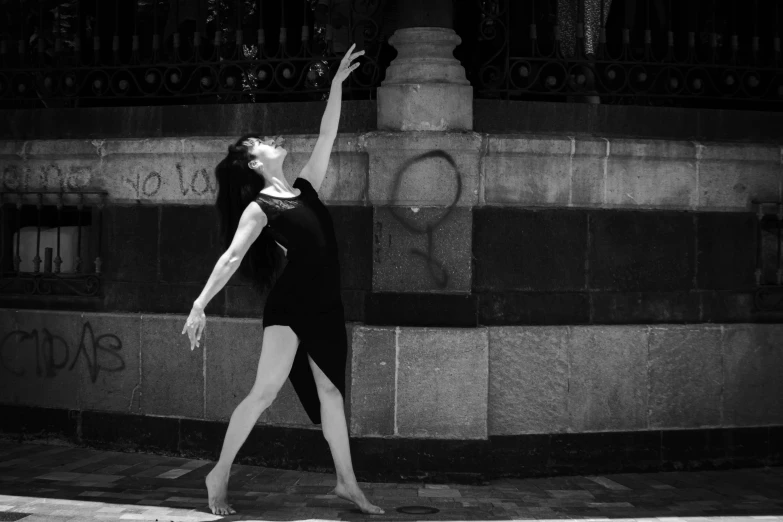 a black and white po of a woman dancing