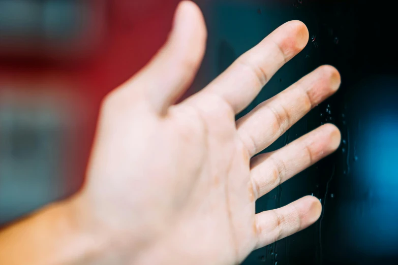 hand on the glass door, about to start using it