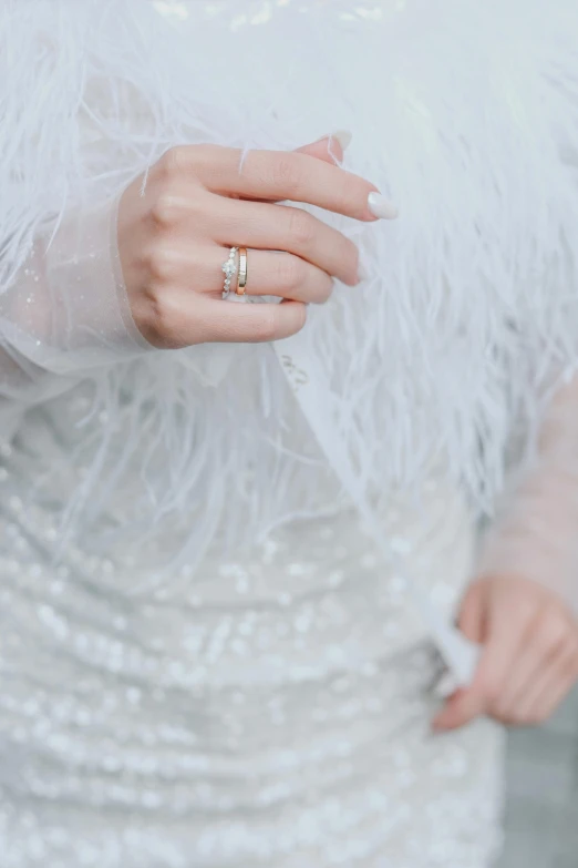 a woman holding a ring in her hand