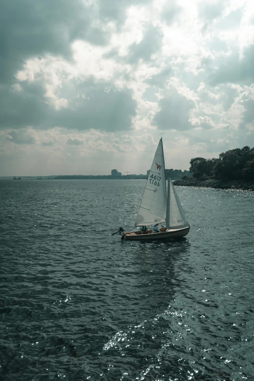 a sailboat floating on a body of water