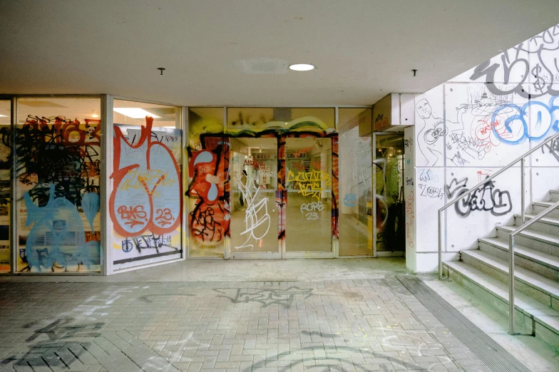 an empty building that has graffiti on it