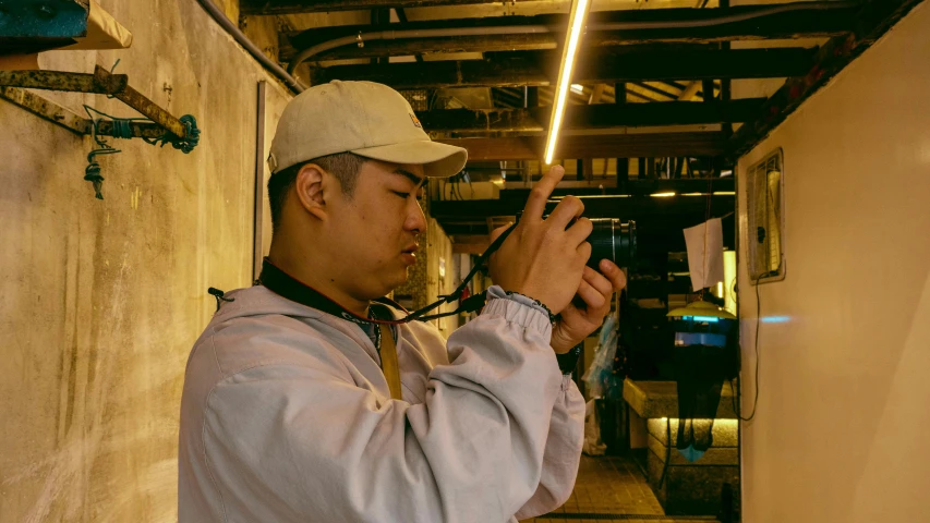 a man wearing a cap and holding a saber