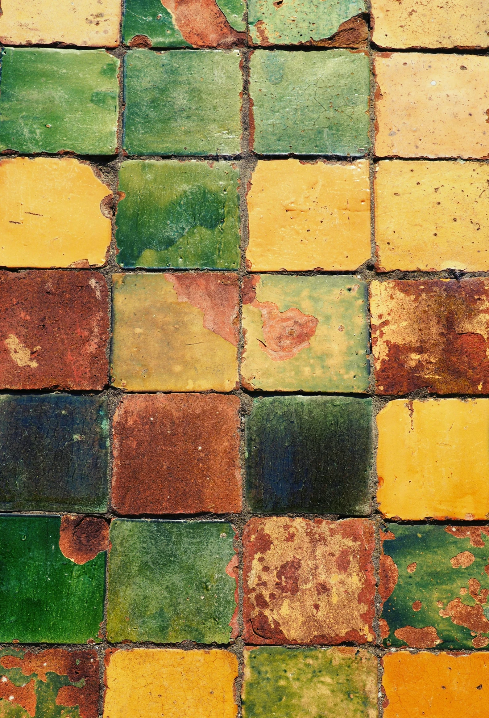 a colorful floor covered in lots of different colored tiles