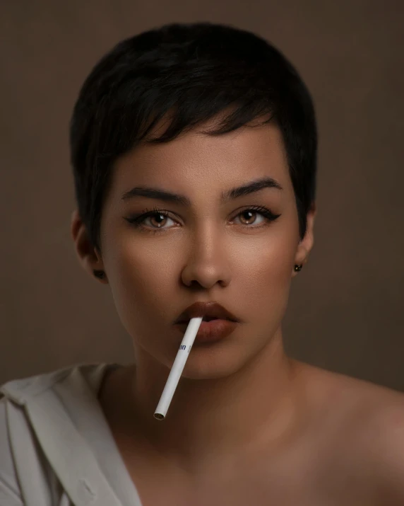an attractive woman smoking with an intense look on her face