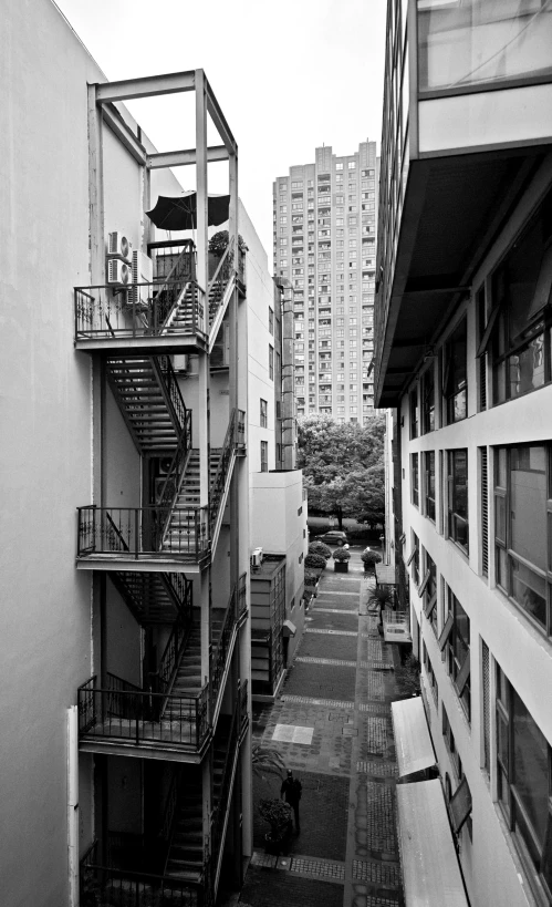 a view from an apartment building looking down at a couple of buildings