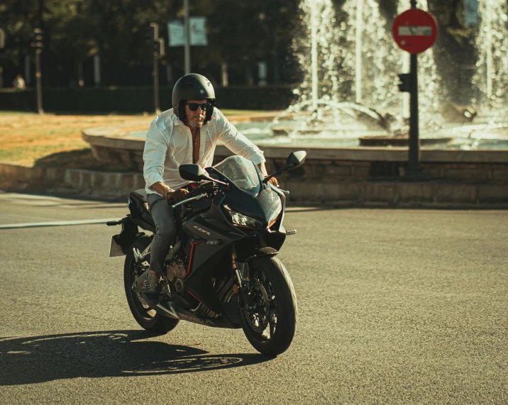 a man riding on the back of a motorcycle