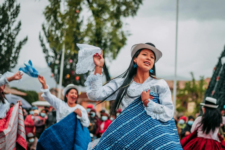 woman in a long dress dancing on the ground