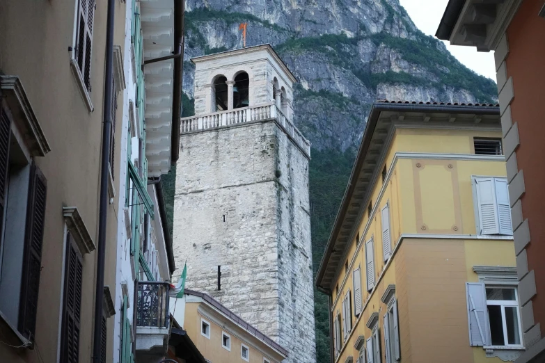 the tall clock tower has several balconies on it