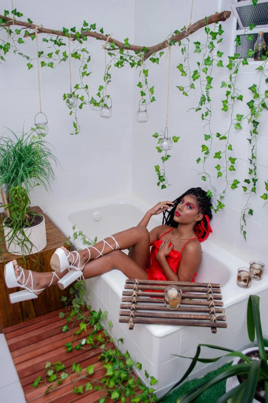 a young woman is relaxing in a bathroom with plants