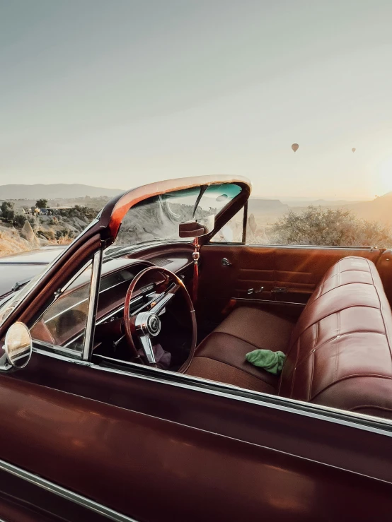 an open car door sitting on the side of a road