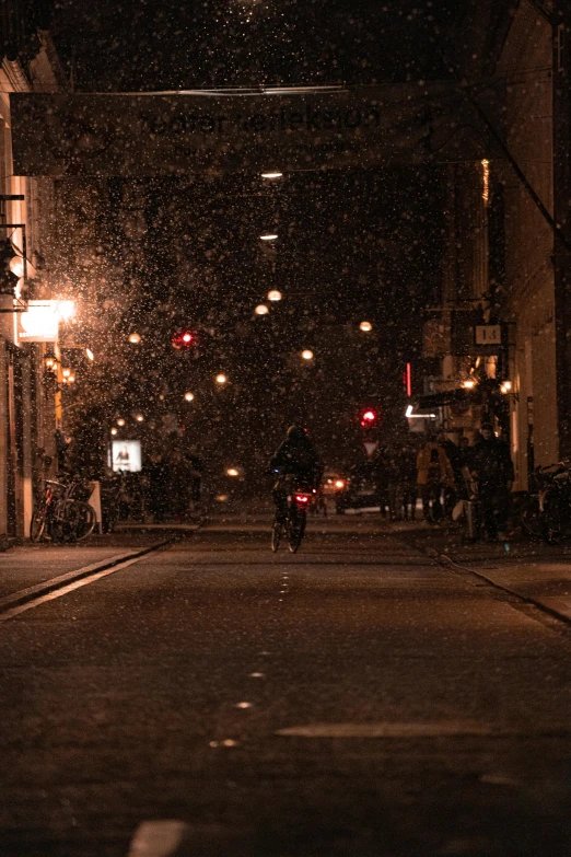 a dark city street at night during the fall and winter