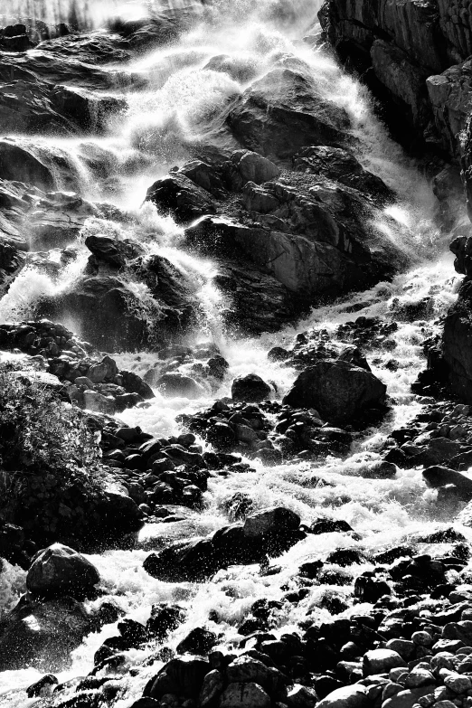 a black and white po of waves hitting the shore