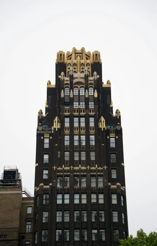 tall building on a cloudy day with windows in the bottom