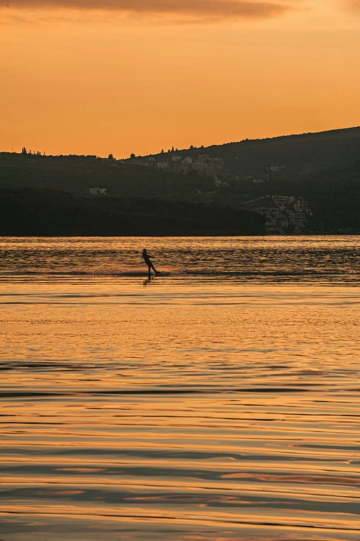 a person is riding in the middle of the water