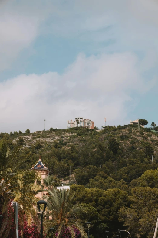 a house is perched on top of a hill