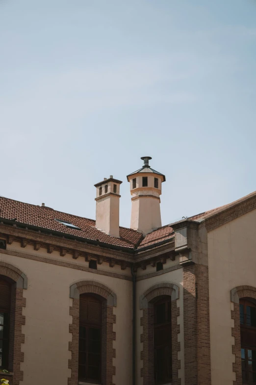 three chimneys are on the side of a building