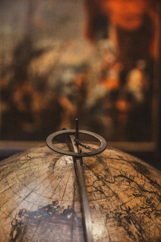 a close - up of an old globe with a black ring