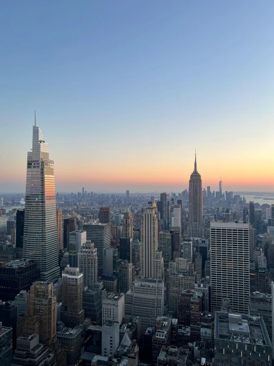 a city filled with tall buildings under a sky