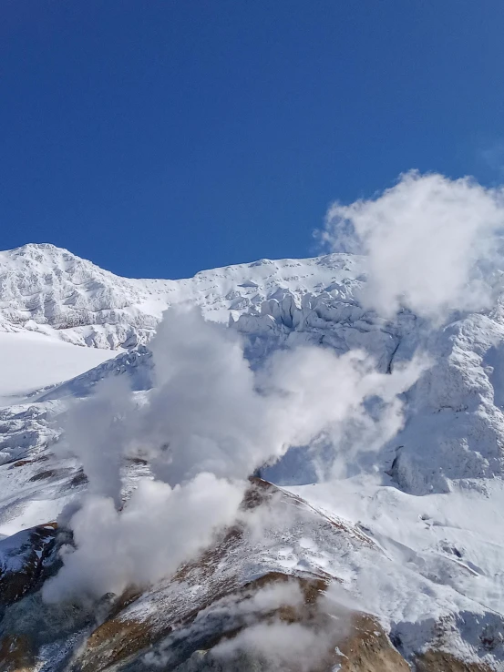 an image of the back end of a snowy mountain