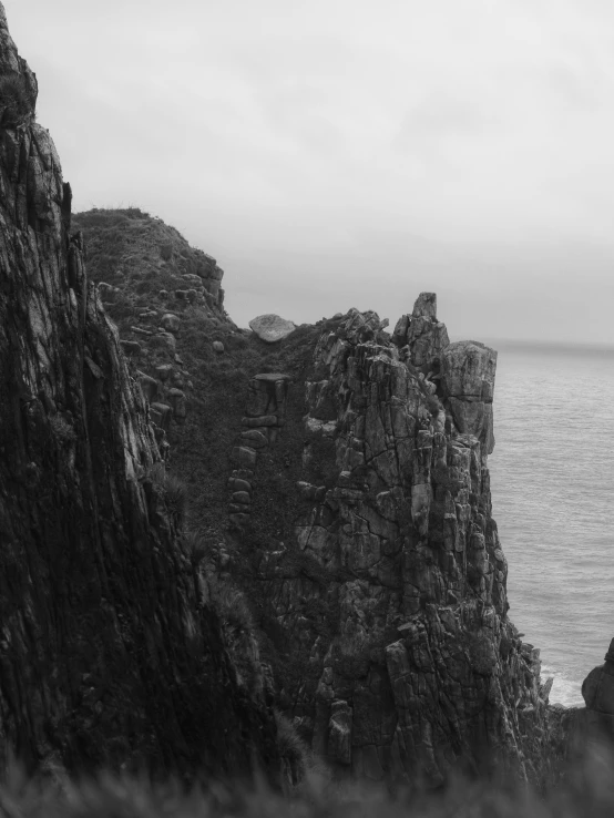 a black and white image of two cliffs