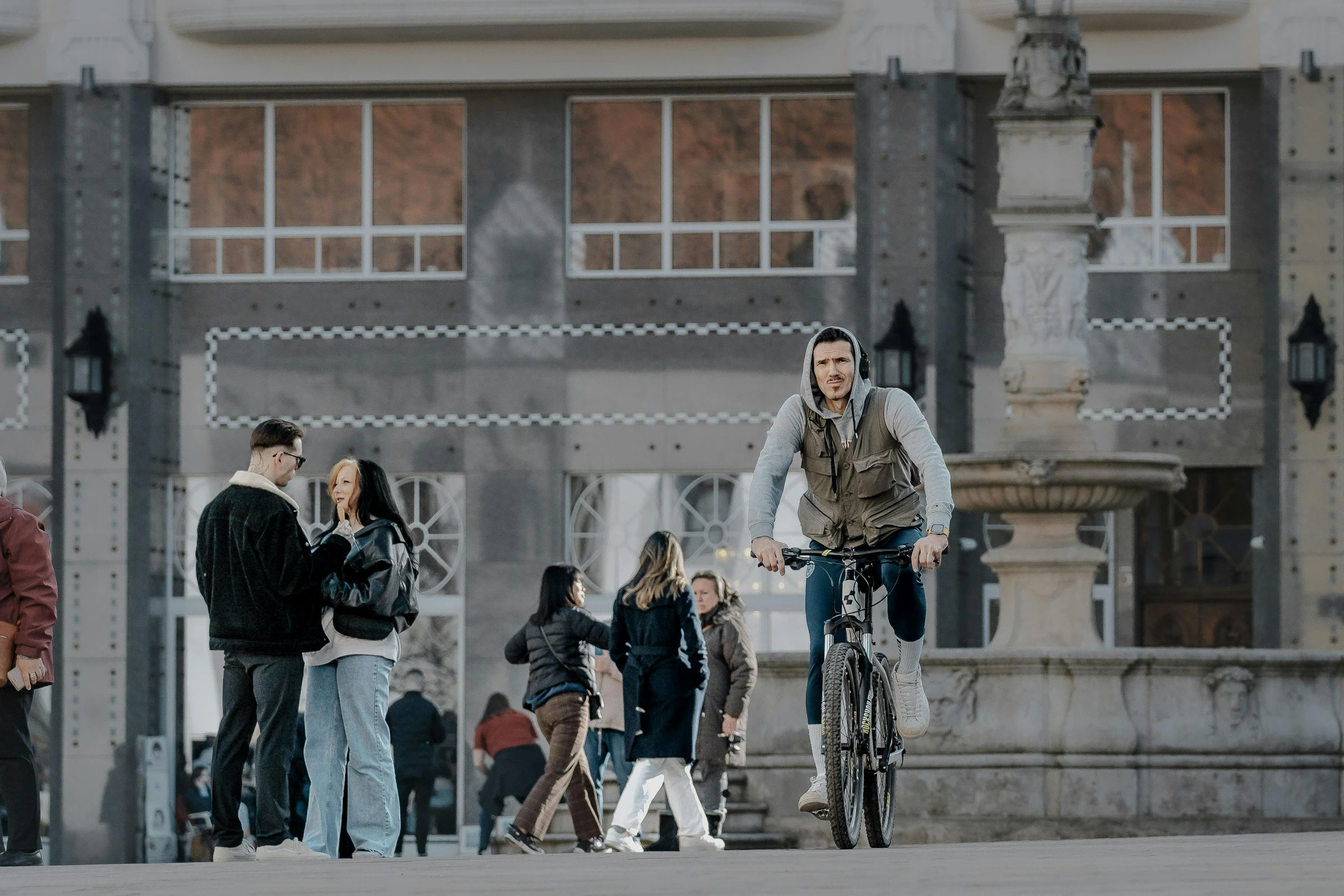 a man is riding a bicycle with his child