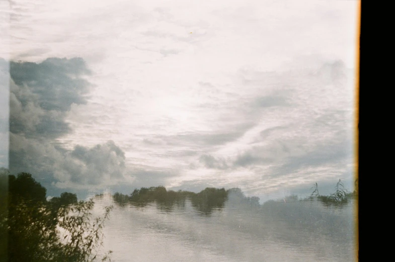 view from the water looking down at cloudy sky