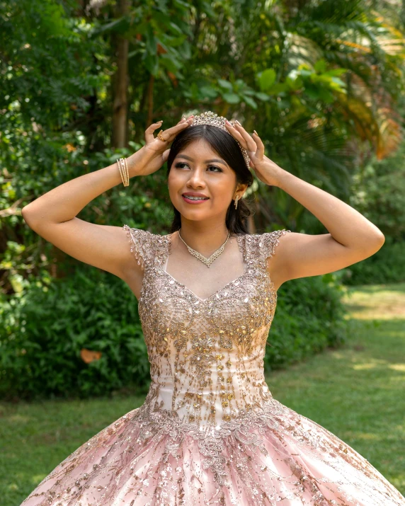 a woman wearing a dress is posing outside