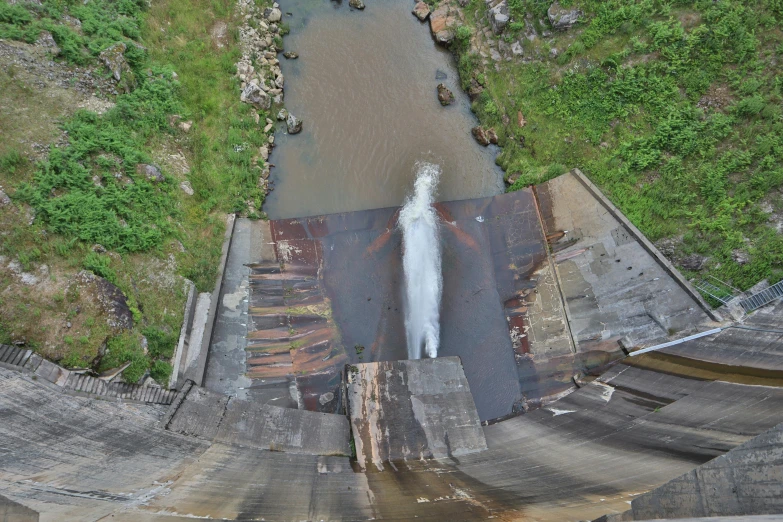 an aerial view of a river running through a cement pit