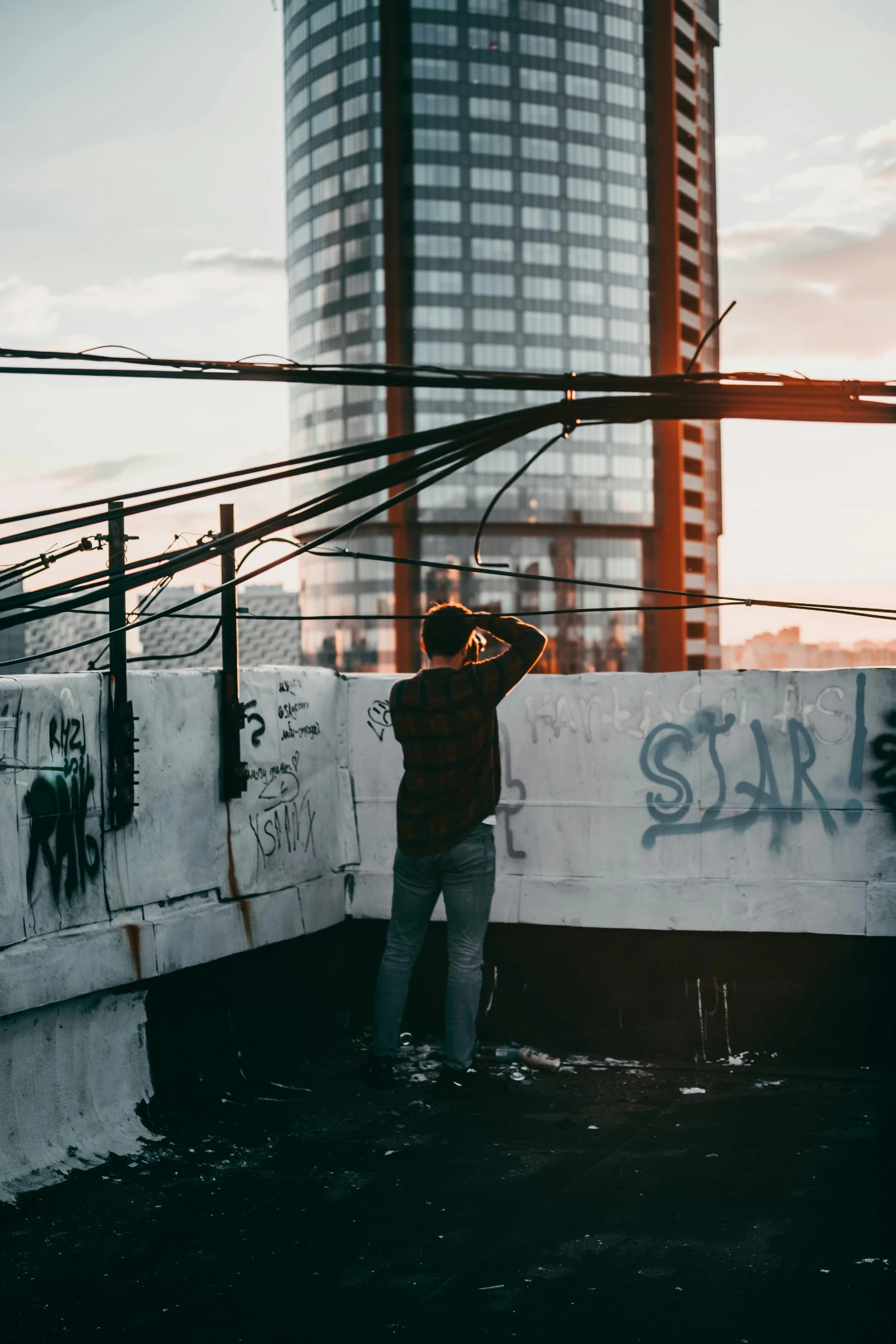 a  standing in front of a tall building