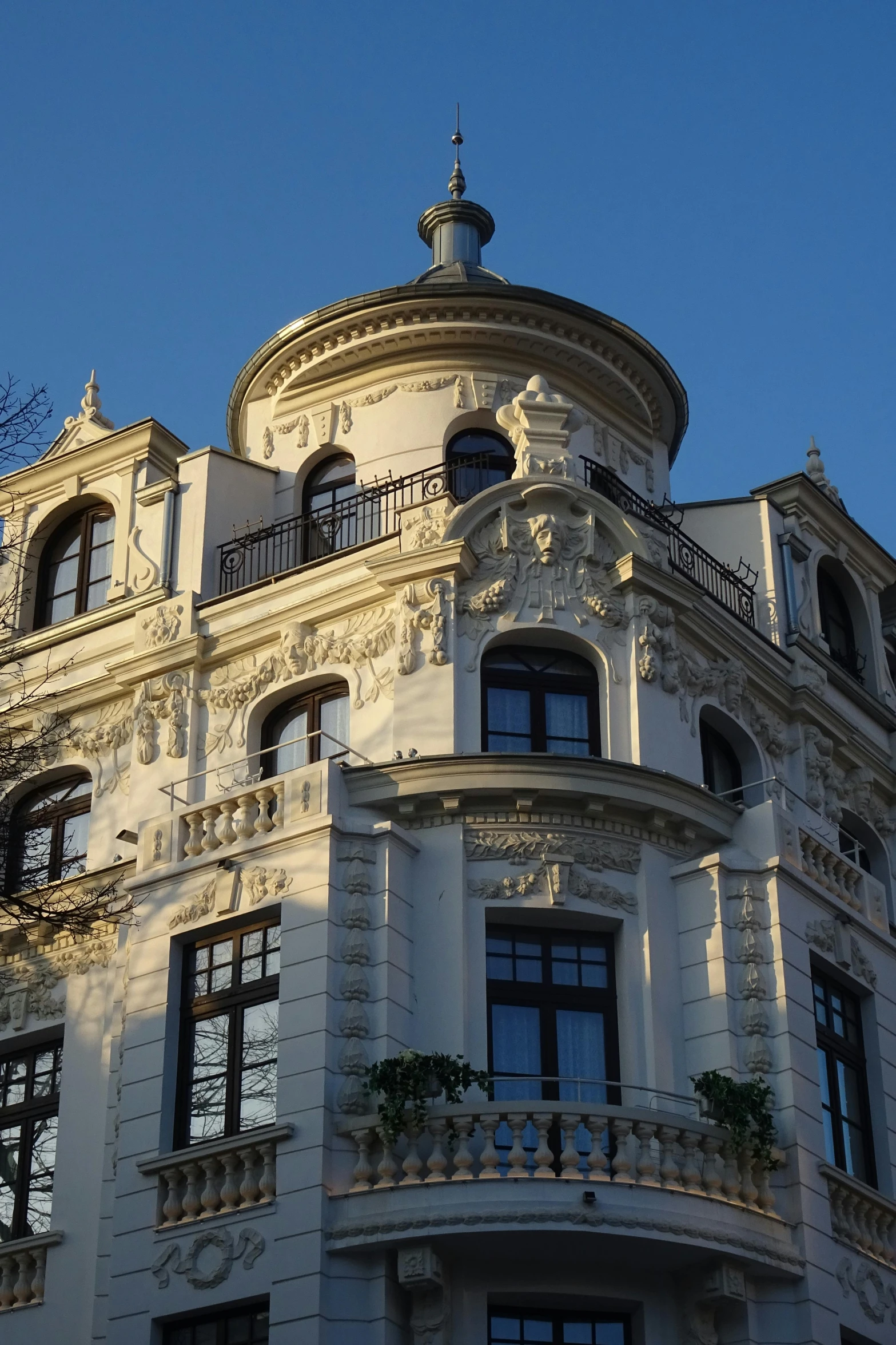 an ornate building with balconies has some windows