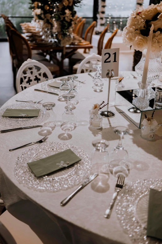 a table is set with silverware and place cards