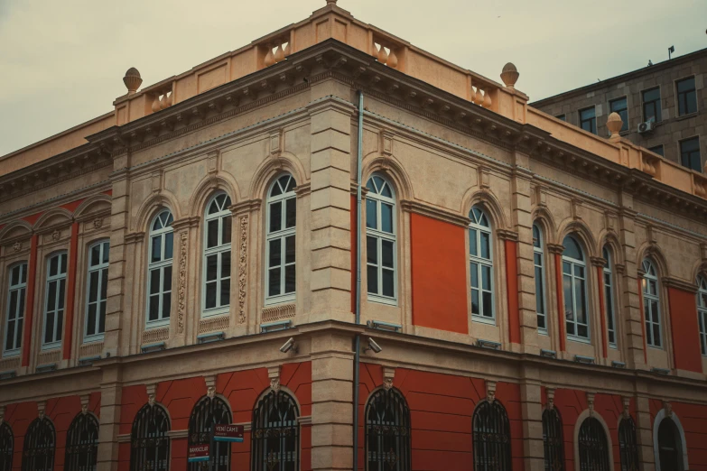 a red building with windows and a clock tower