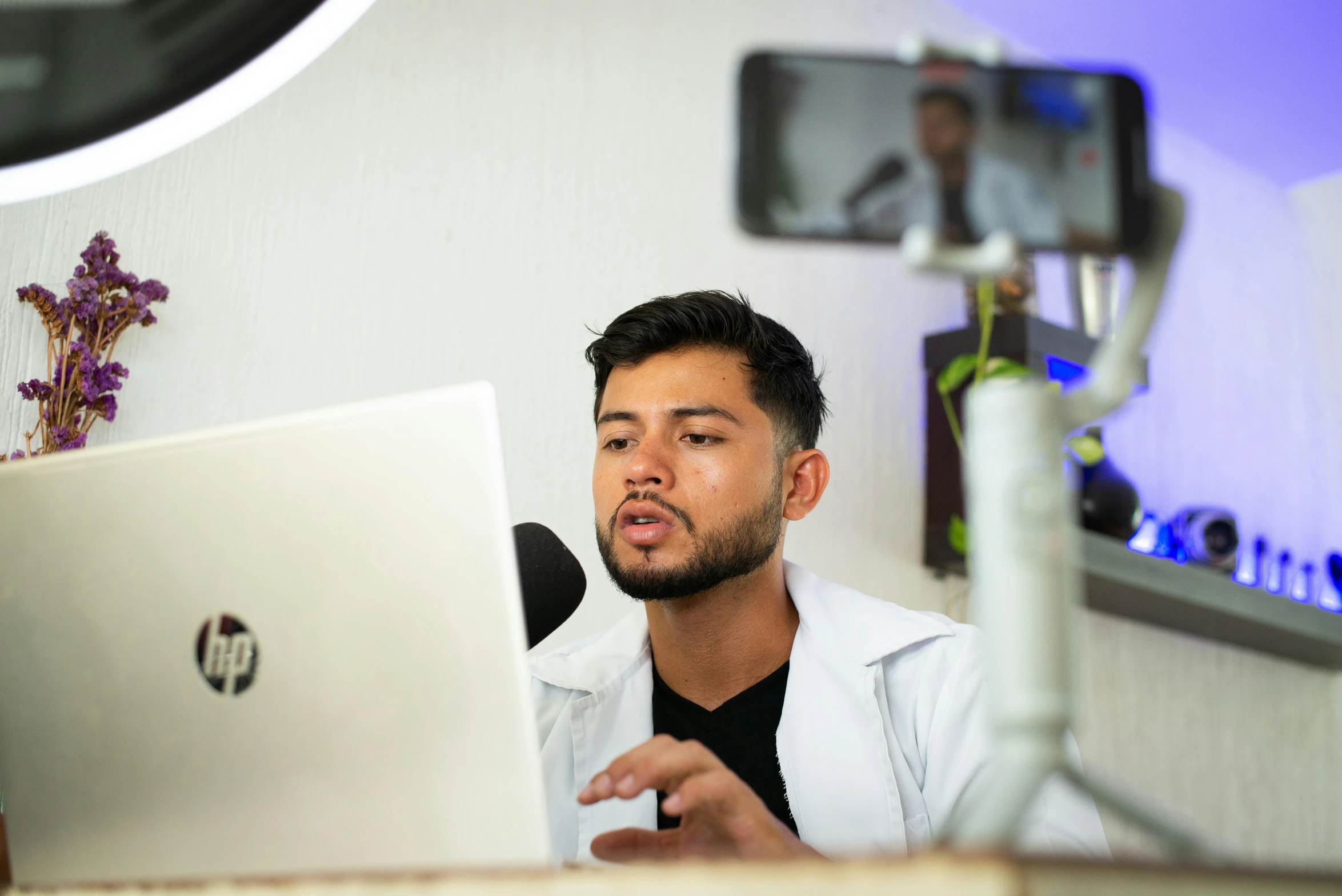 a man sitting in front of his laptop computer