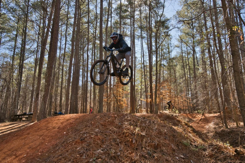 a man on a mountain bike in mid air