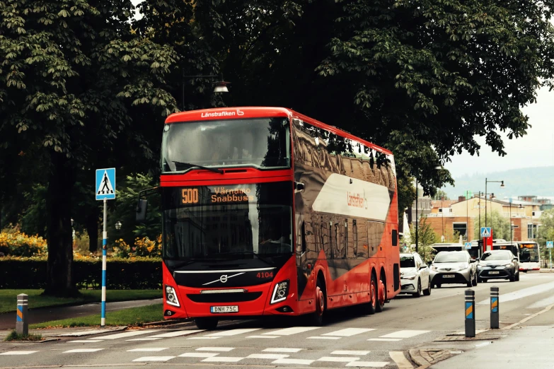 the bus is carrying cargo down the street