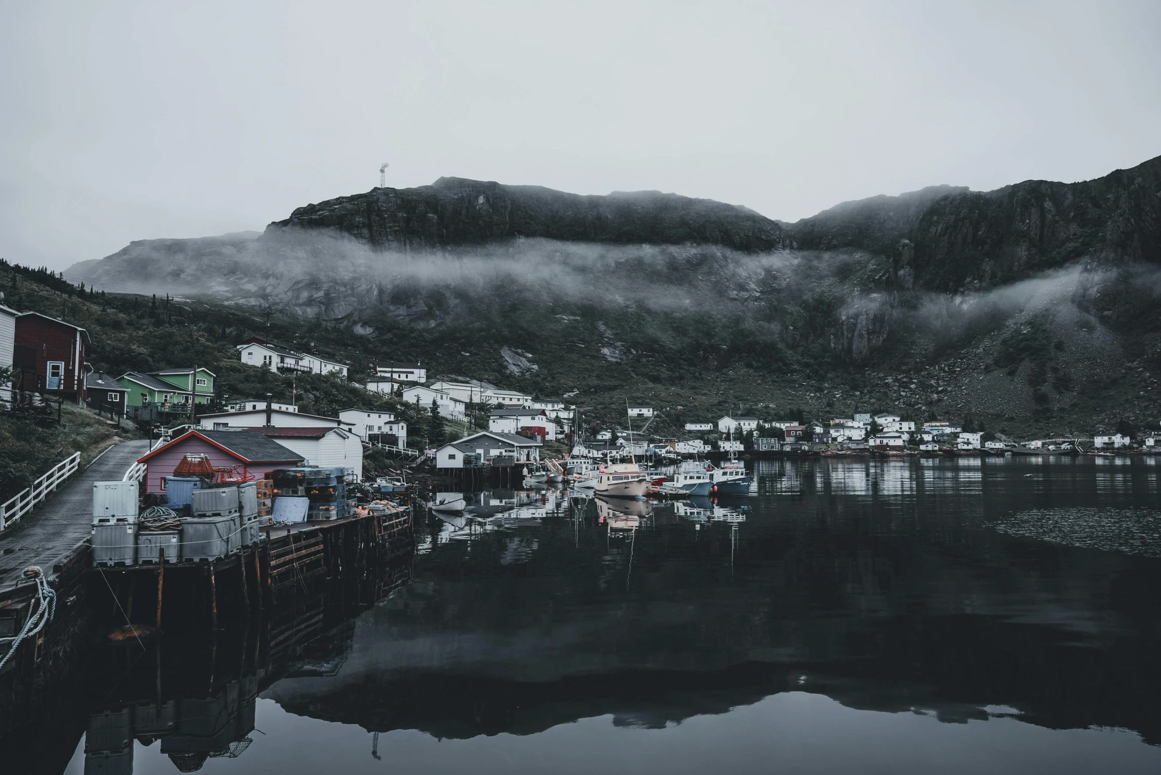 a view of a town with mountains behind it