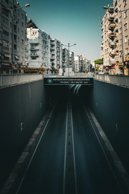 a tunnel that is on the side of a road