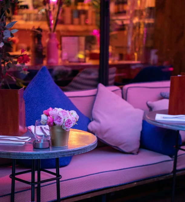 a fancy restaurant table with some flowers in vases