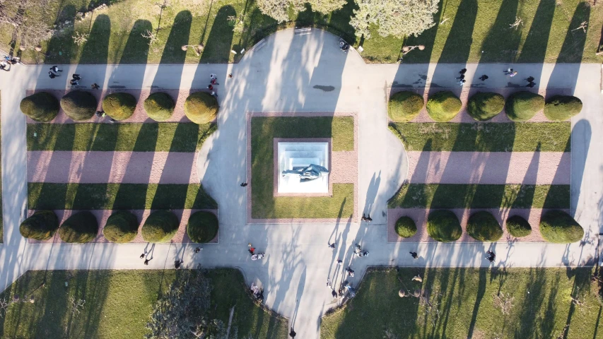 aerial po showing benches on grass in city park