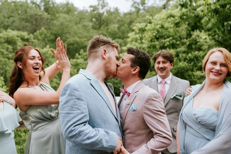 wedding party in the woods outside together