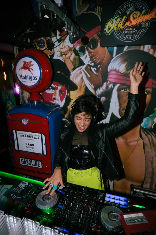an individual at a dj booth playing music