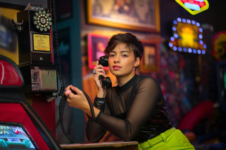 a woman using an old telephone to call